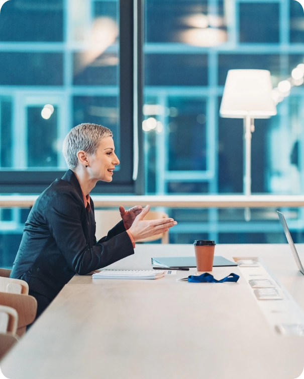 Woman explaining with laptop in front of her