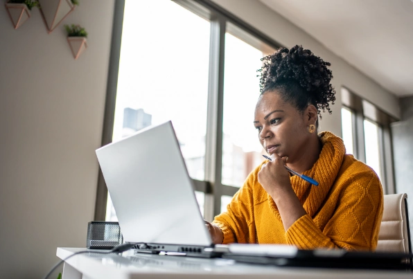 Woman looking at her laptop